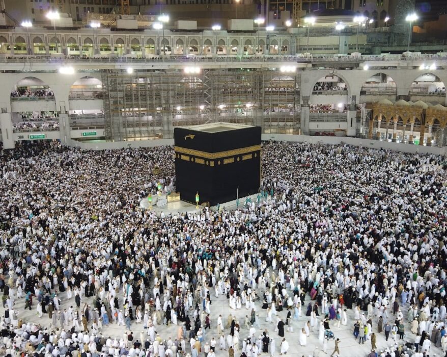 A Group of People Standing Near the Kaaba