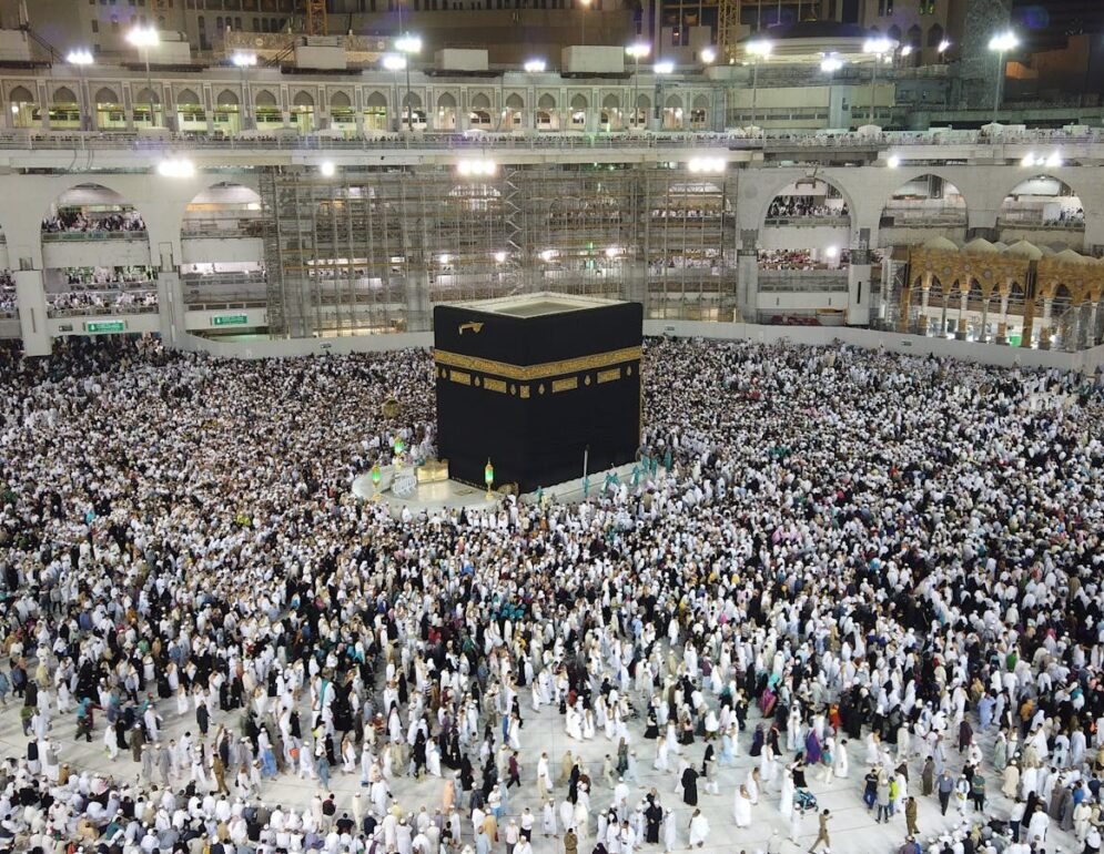 A Group of People Standing Near the Kaaba