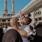 A Crowd Standing in the Courtyard of a Mosque