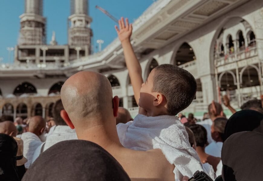 A Crowd Standing in the Courtyard of a Mosque